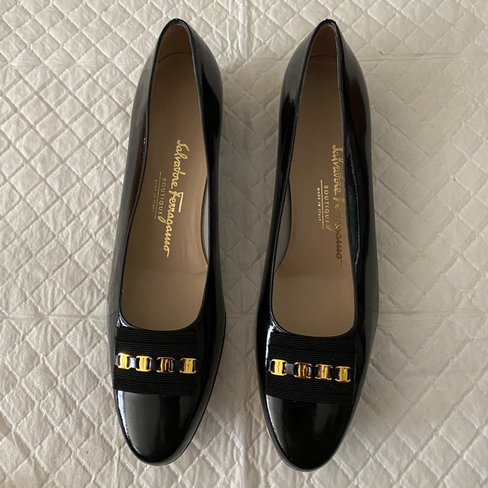 Salvatore Ferragamo black patent leather flats.